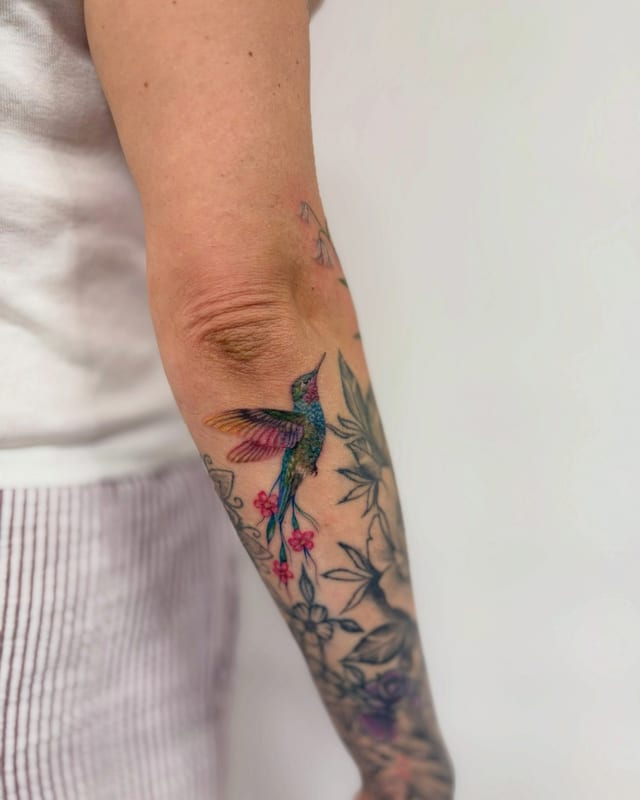 Caitlan Toddington @cxitlantattoos from Rebel With A Cause Tattoo @rebelwithacausetattoo._ crafted this incredible, color realism hummingbird recently and it's